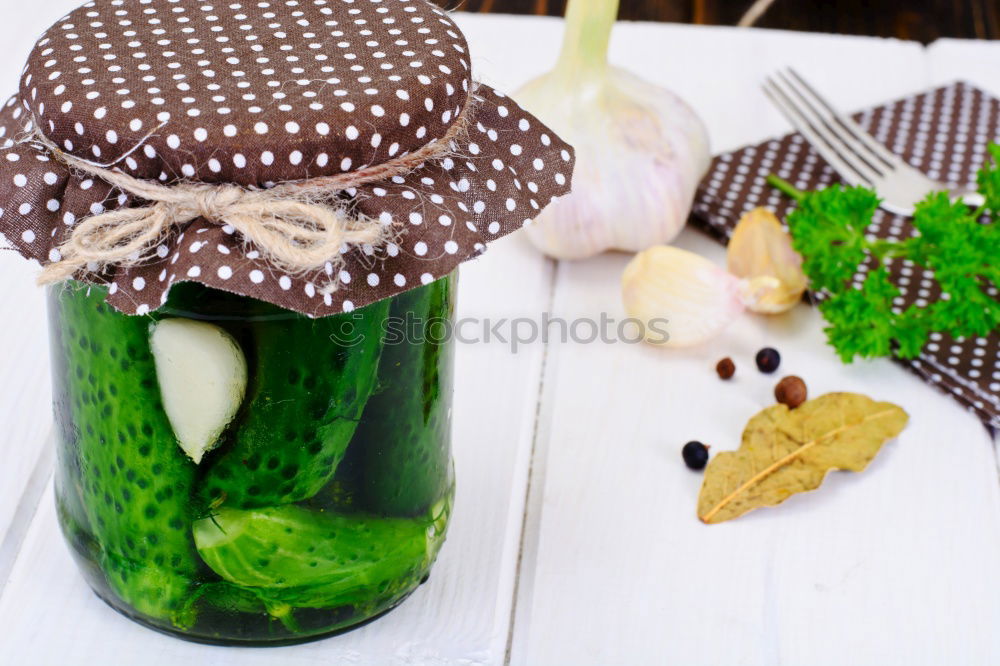 Similar – Pickled cucumbers made of home garden vegetables and herbs