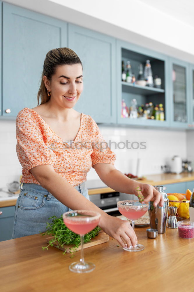 Similar – Image, Stock Photo Young couple cooking. Man and woman in their kitchen