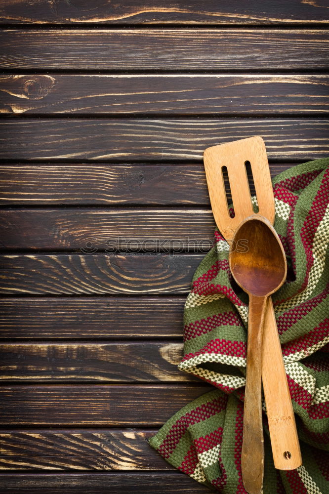 Similar – Black cast-iron frying pan with a wooden spatula