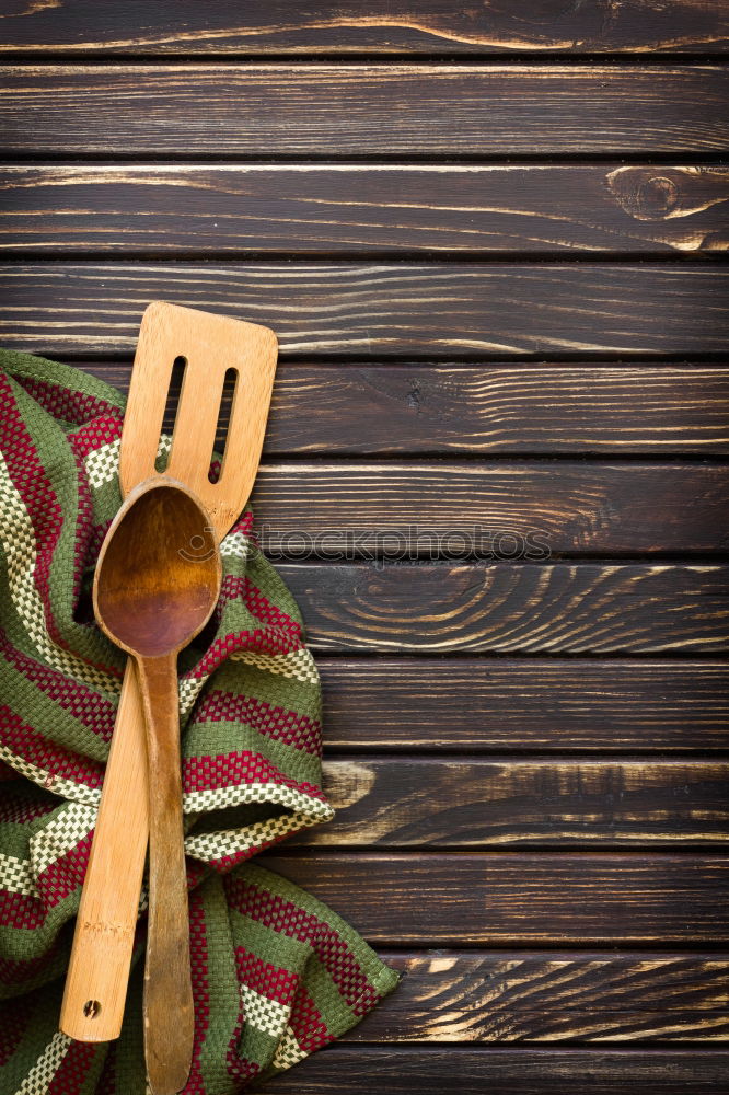 Similar – Black iron pan with a wooden handle and a spoon