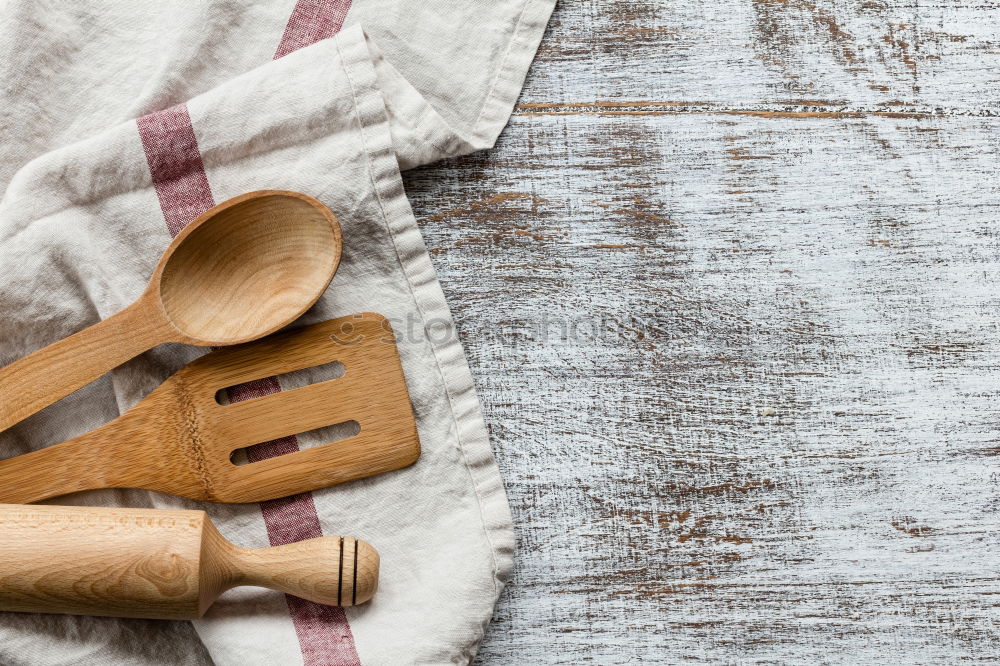 Similar – Black frying pan with a kitchen spatula, brown surface