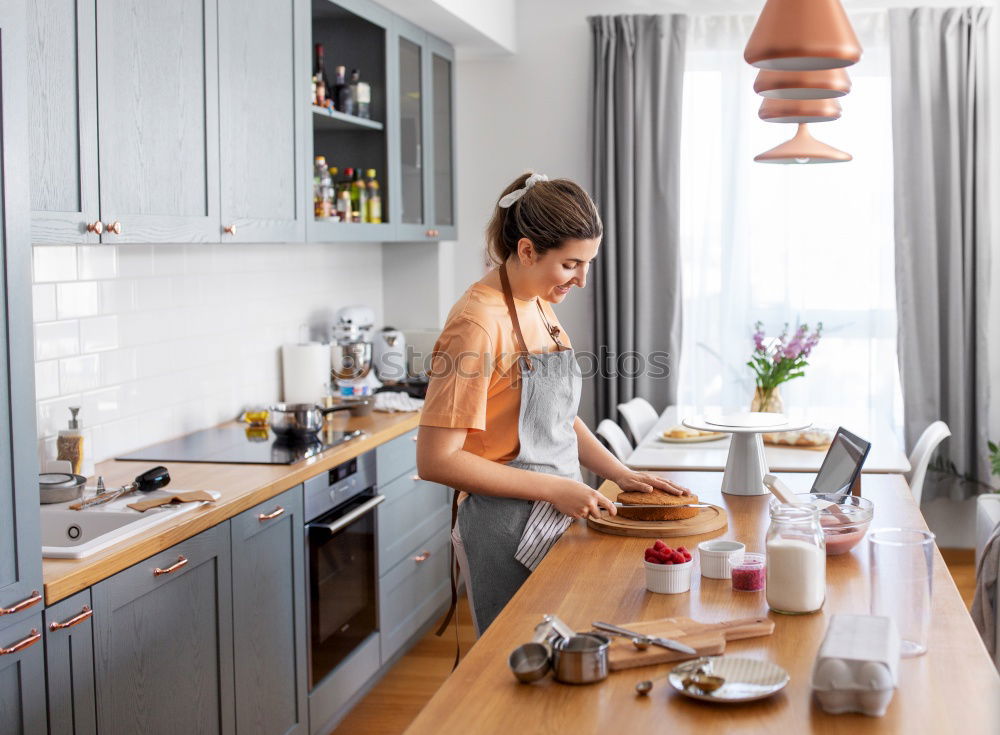 Similar – Woman preparing sandwiches in kitchen