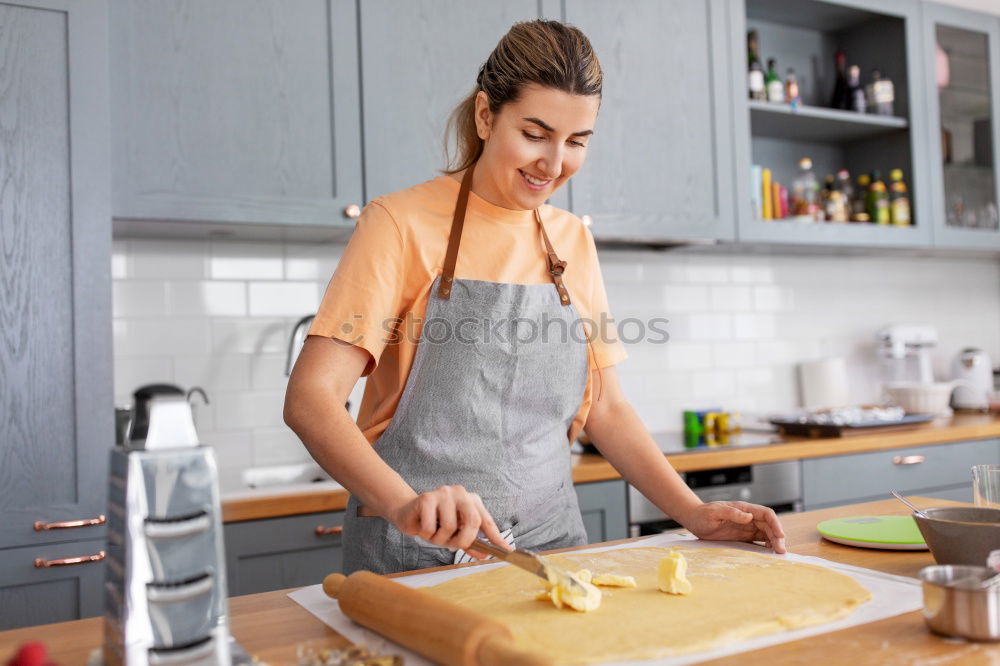 Similar – Young couple cooking. Man and woman in their kitchen