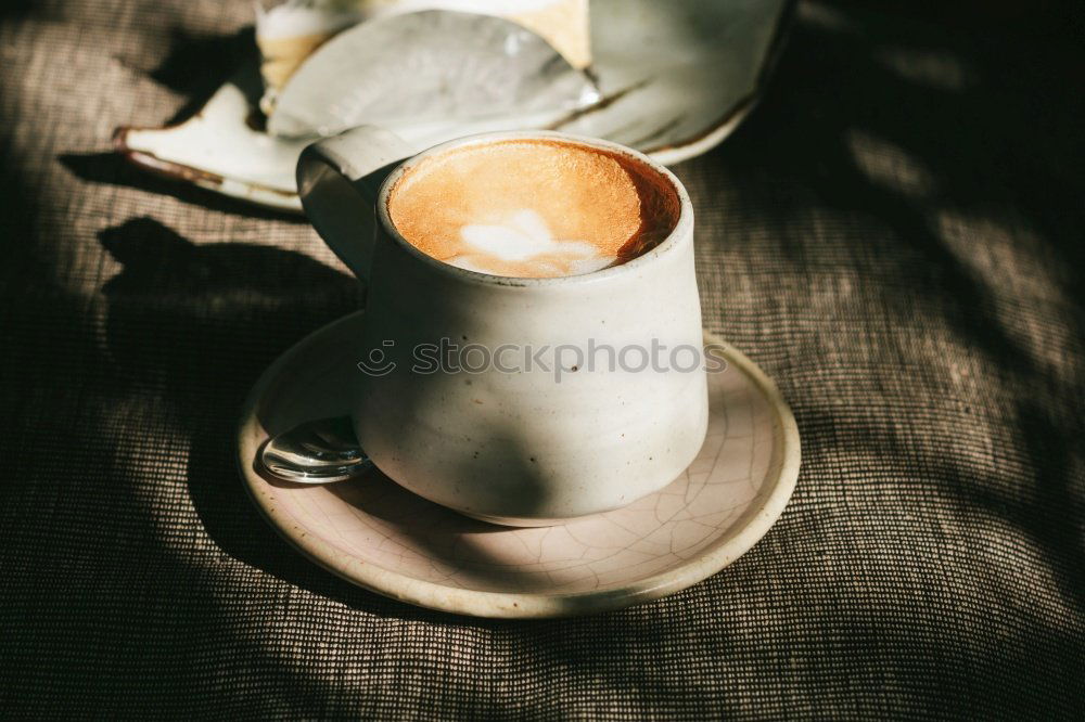 Similar – Cup of coffee on old wooden table with kitchen towel