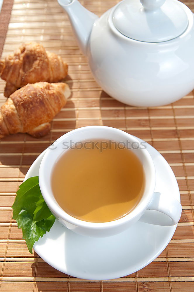 Similar – tea break with cups, flowers, cake and teapot