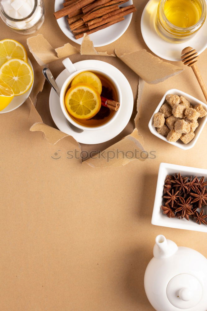 Similar – Image, Stock Photo Tea- Time: a tea cup with tea bag, sugar and cookies on a wooden table