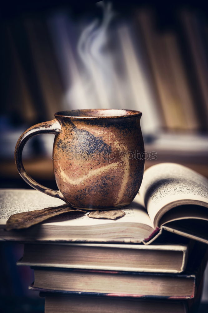 Similar – Image, Stock Photo A cup of coffee on a leather couch
