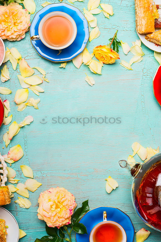 Similar – Tea brunch with coloured teacups, teapot and cake