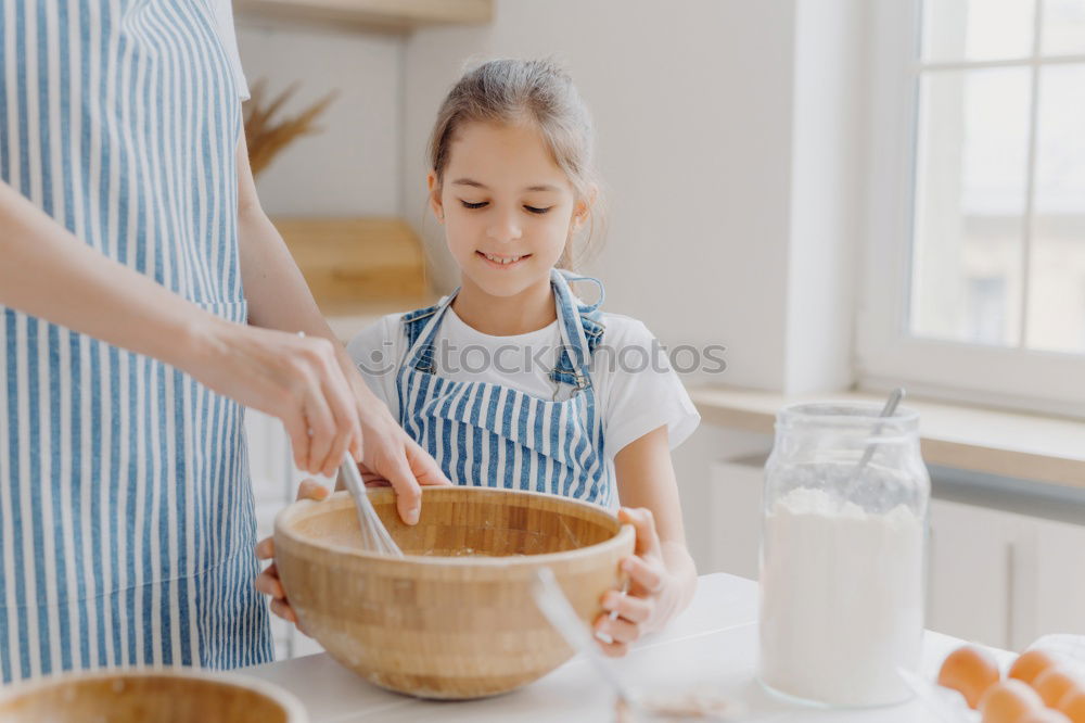 Similar – little african girl making cupcakes in kitchen