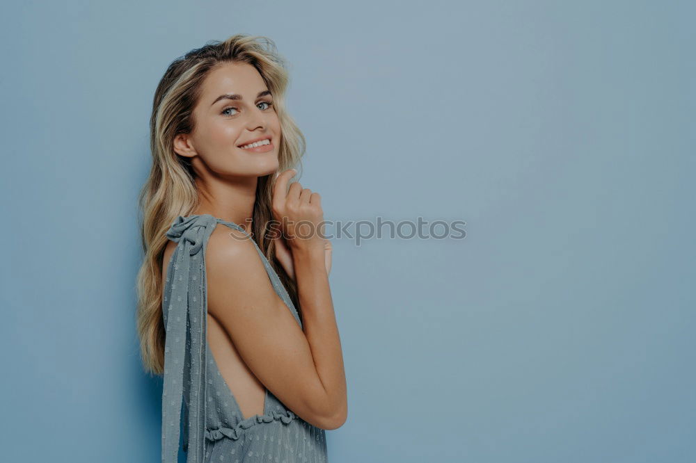 Similar – Young woman smiling in urban background.