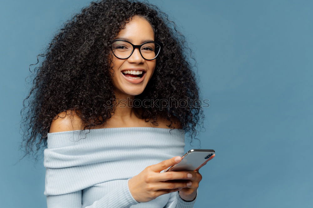 Similar – Image, Stock Photo Beautiful afro american woman using mobile in the street.