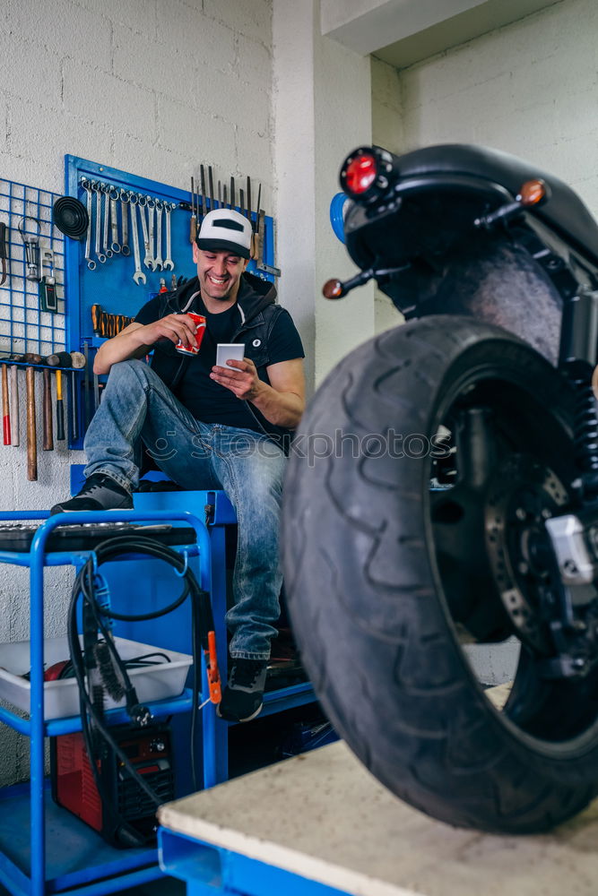 Similar – Image, Stock Photo Mechanic checking motorcycle