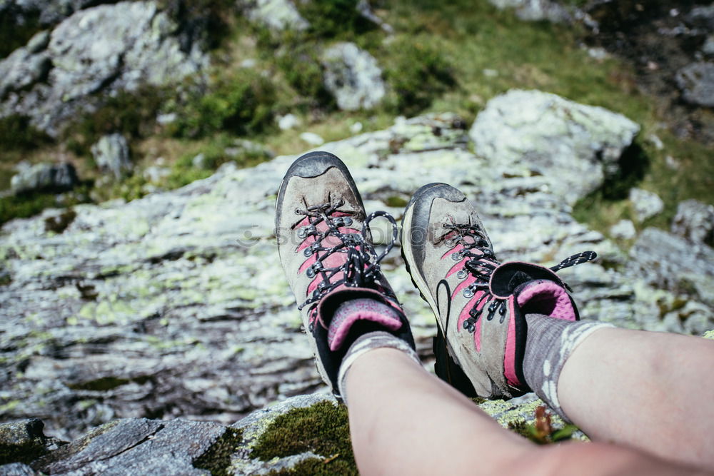 Similar – 2 people hiking show their hiking boots