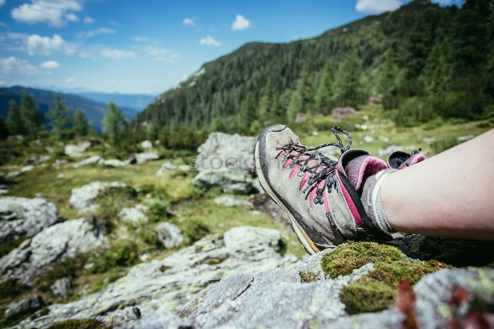 Similar – 2 people hiking show their hiking boots