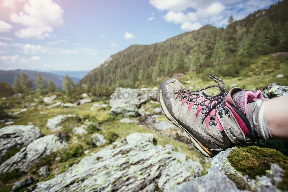 Similar – 2 people hiking show their hiking boots