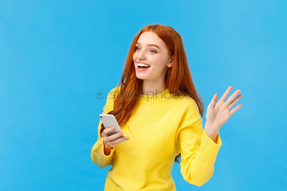 Cheerful woman in yellow jacket