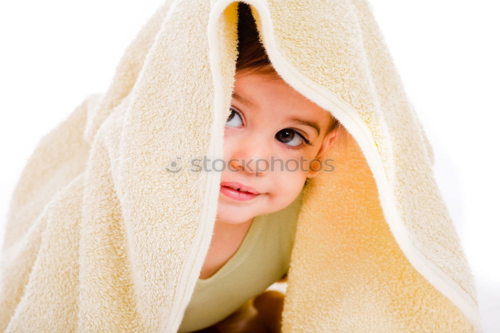 Cute, cute, cute, smiling, little, dreamy, sweet, sweet, blonde girl with pony and sweater in pink, pink observes, curious, interested, cheeky, his surroundings and holds on to the railing from the climbing on the playground.