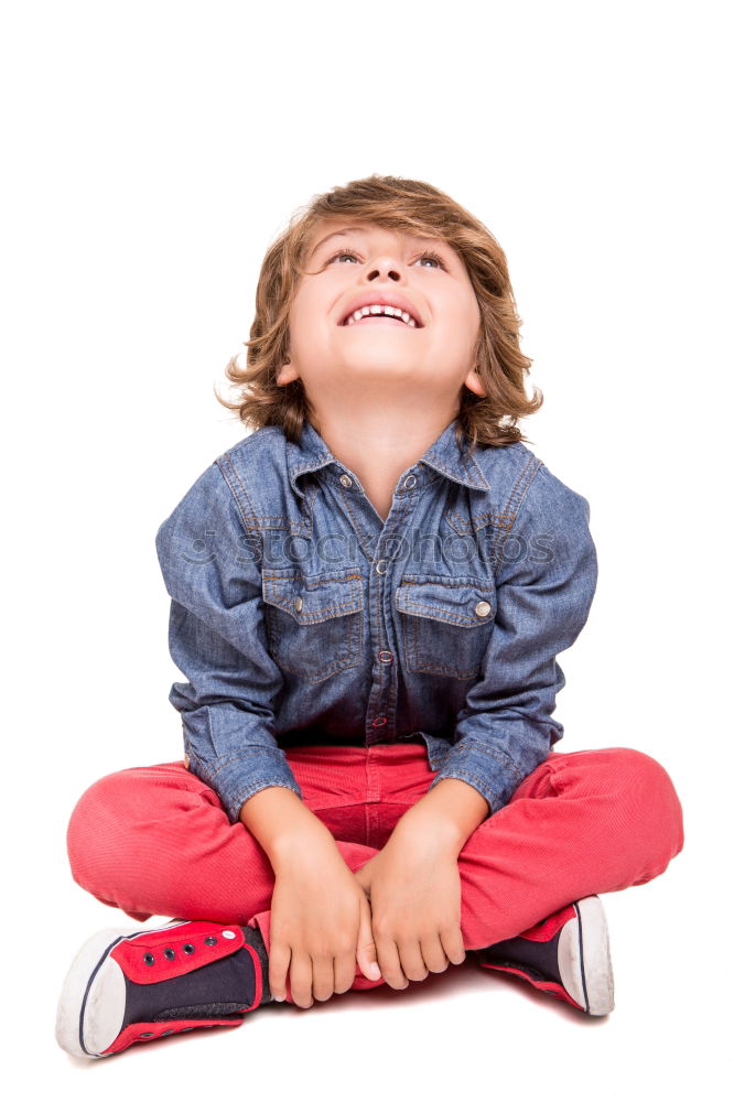 Similar – Boy straightens his tie and looks in the air