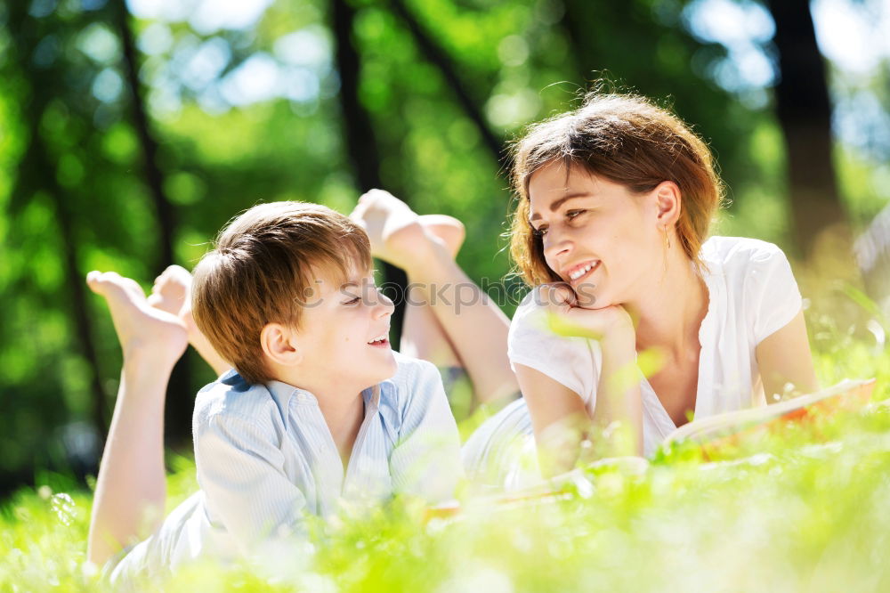 Similar – Image, Stock Photo Mother and son seated on a park