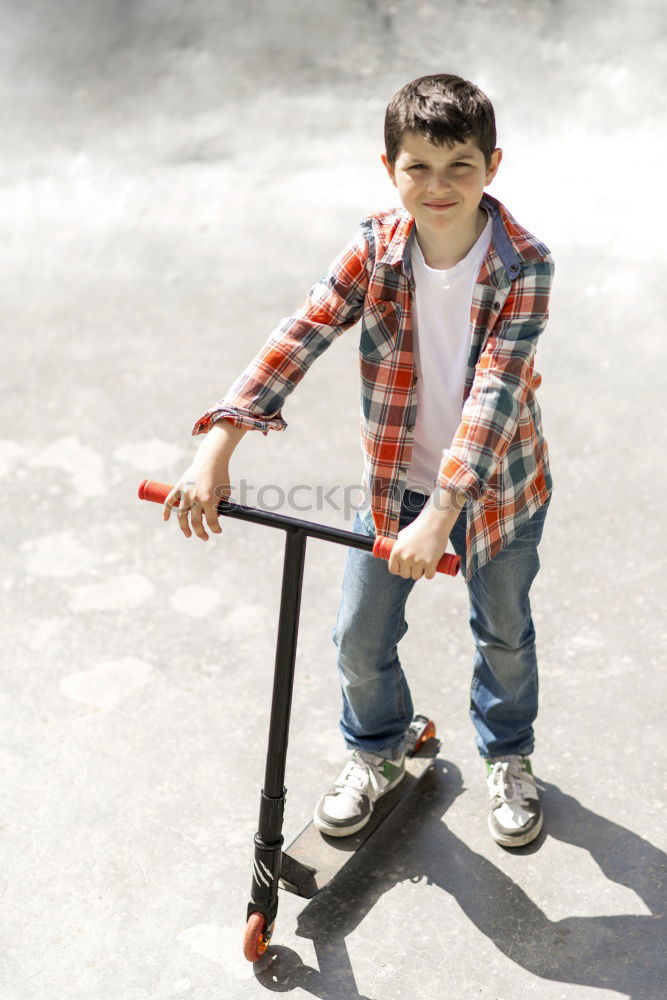 Similar – Image, Stock Photo A smiling boy with skateboard sitting alone on the floor