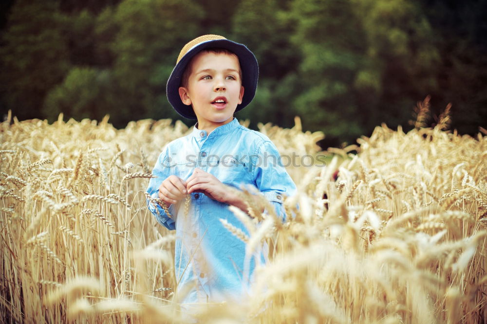 Similar – Little girl walking in nature field wearing beautiful dress