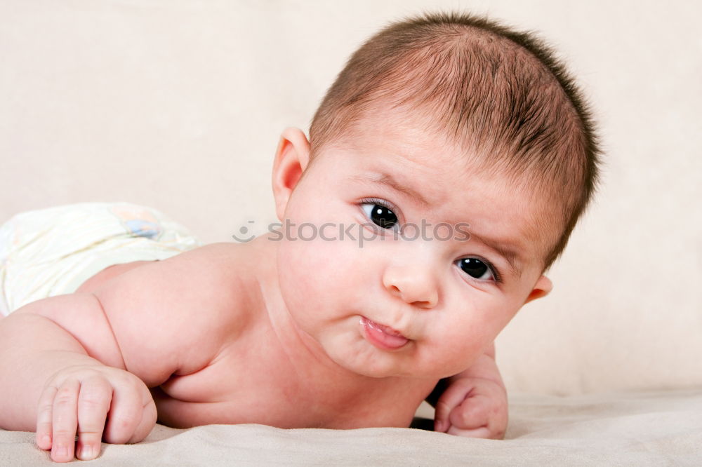 Similar – Happy baby girl, four months old, on the bed with pacifier.