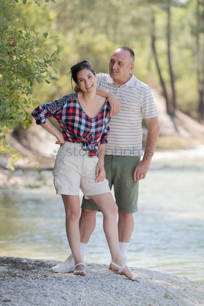 Similar – Image, Stock Photo Young smiling couple on a path in the park.