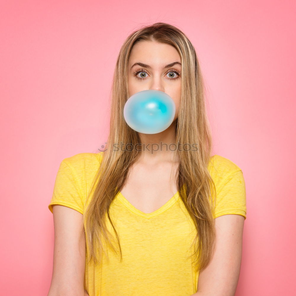 Similar – Image, Stock Photo Young blonde woman making a chewing gum bubble