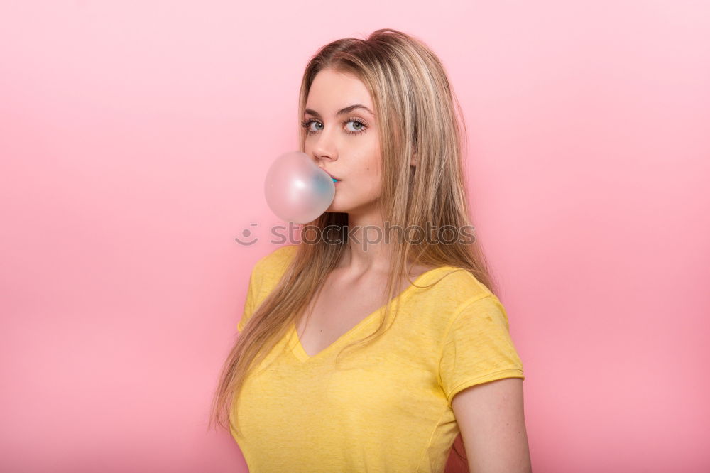 Similar – Image, Stock Photo Young blonde woman making a chewing gum bubble