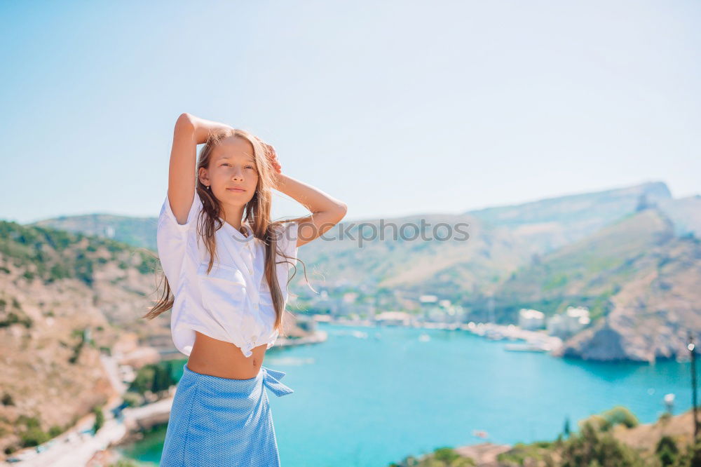 Similar – Portrait of a young woman at Lake Garda