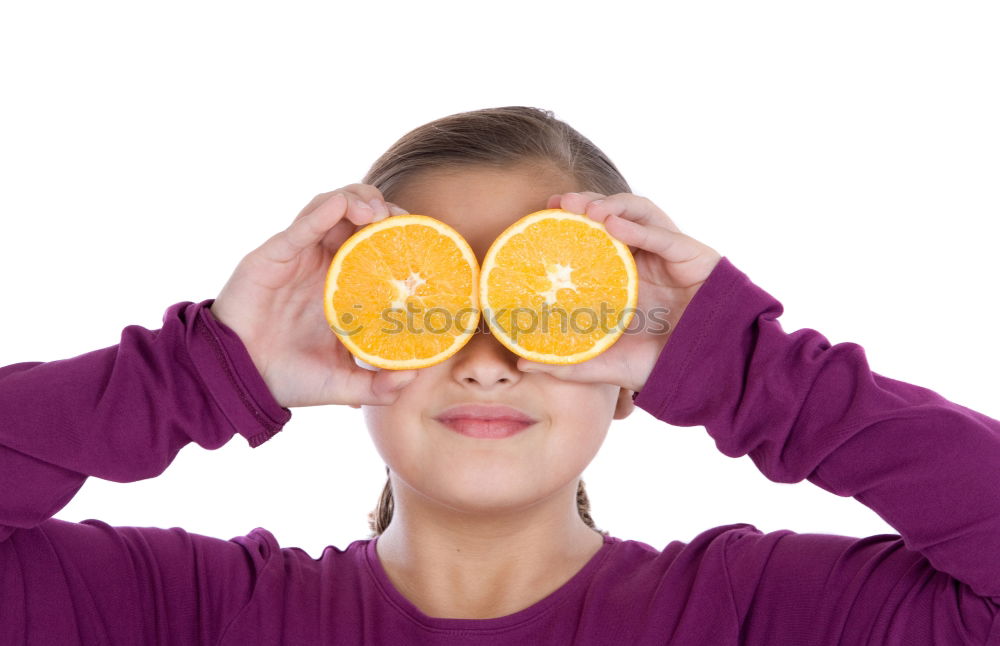 Similar – smiling little girl holding oranges over her eyes