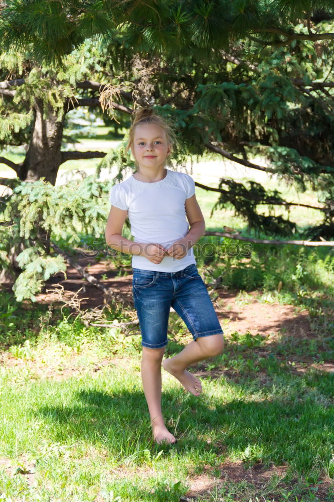 Similar – Cute child in the woods playing alone