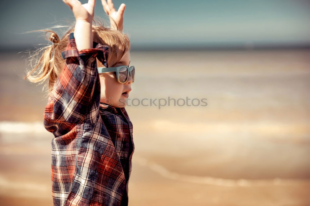 Similar – Image, Stock Photo child girl playing with stones on the beach