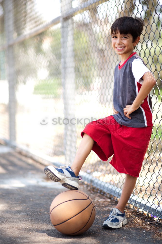 Similar – Teenage playing basketball on an outdoors court