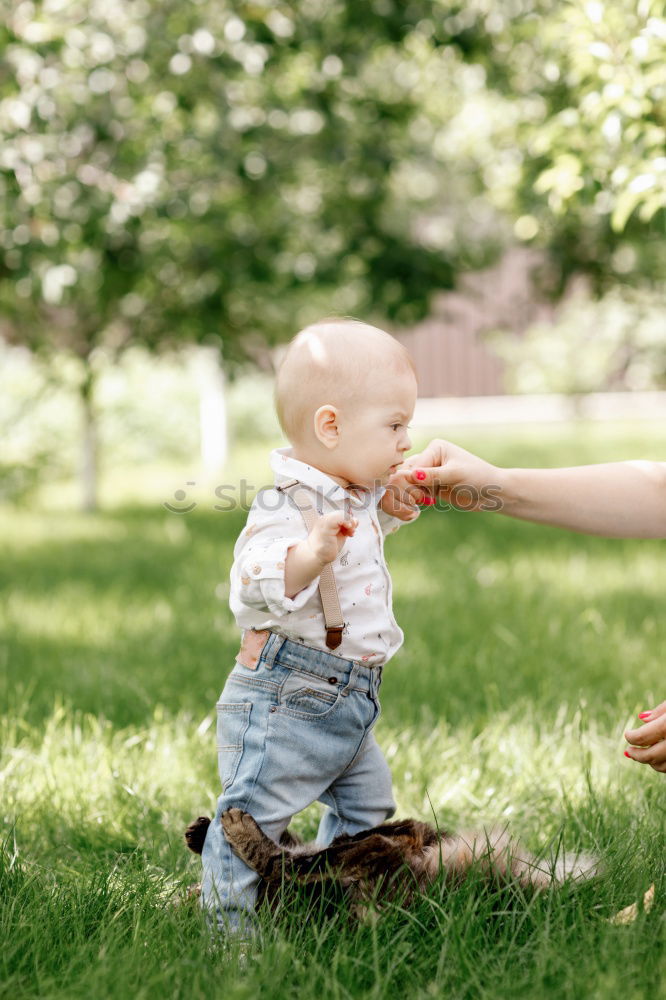 Similar – Image, Stock Photo Mother holding walking child