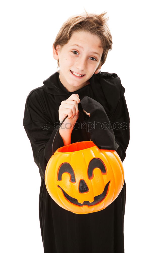 Image, Stock Photo Young boy in the Skeleton costume holding Halloween pumpkin