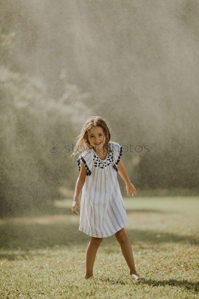 Similar – Kleines Mädchen im Naturfeld mit schönem Kleid