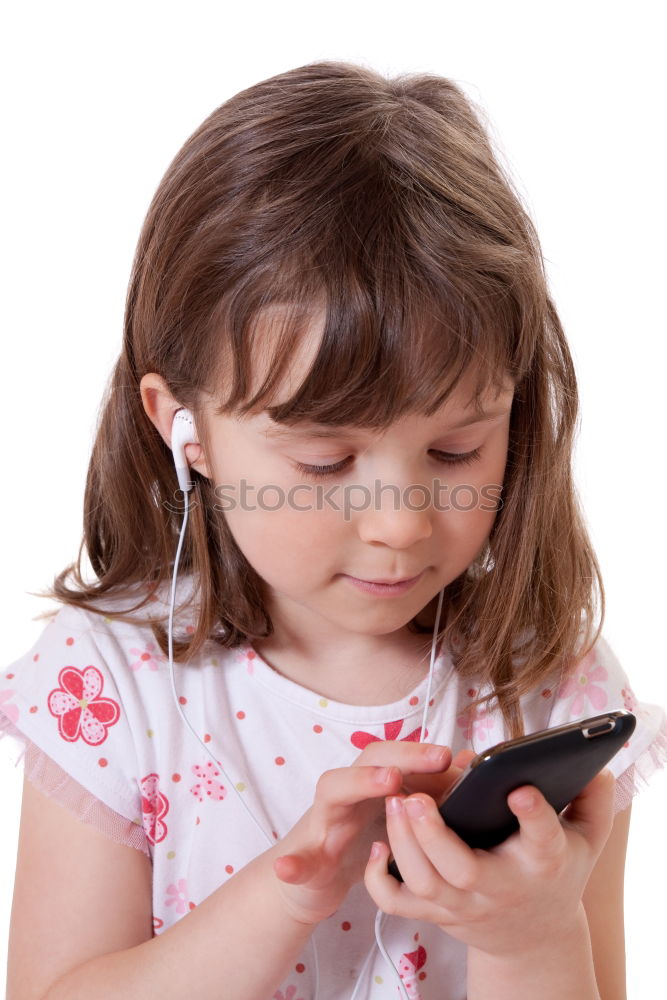 Similar – portrait of a beautiful kid using mobile phone