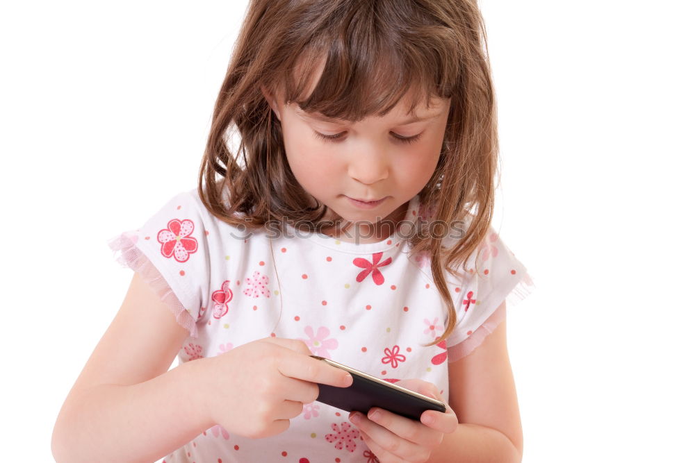 Similar – portrait of a beautiful kid using mobile phone