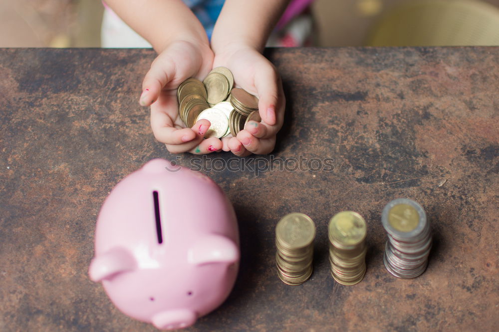 Similar – Thoughtful confused black woman with piggy bank