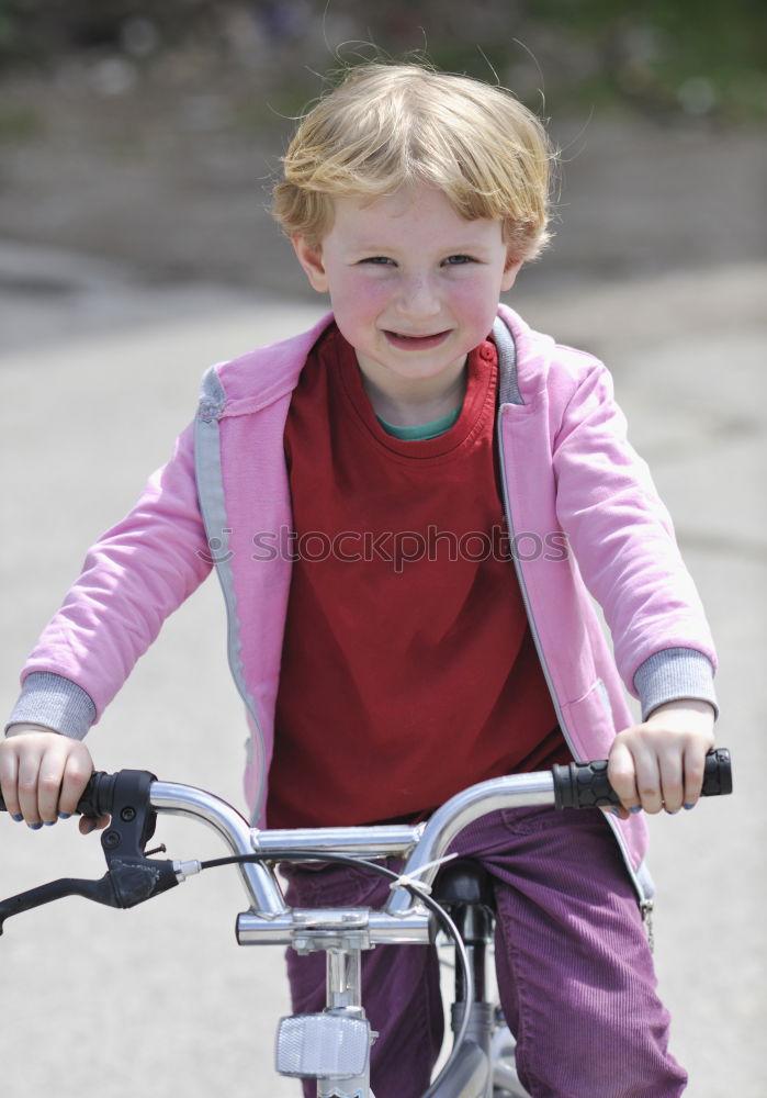 Similar – Cool gap | Portrait of a boy with a bicycle helmet and a tooth gap