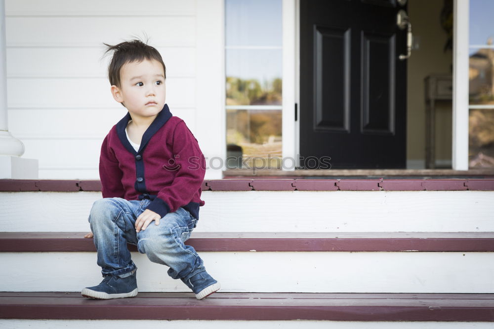 Similar – Happy boy sitting on the floor