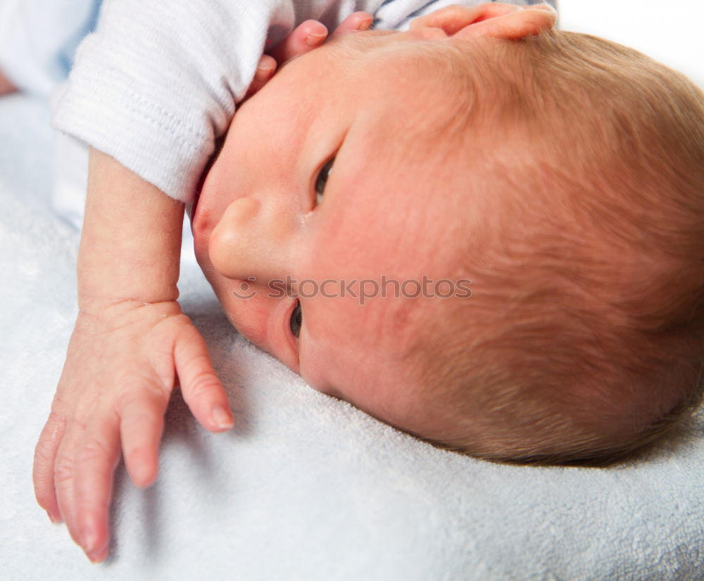 Similar – baby sleeping on his mother’s shoulder