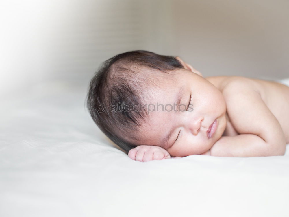 Baby sleeping on a blanket