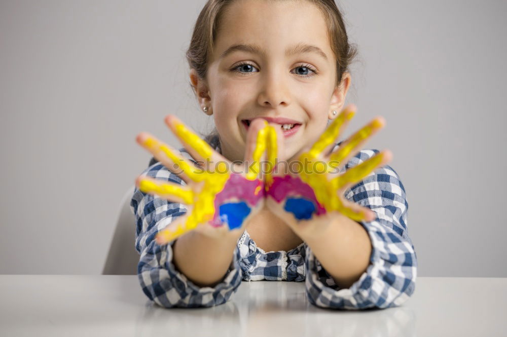 Similar – Girl with clown nose looks into the camera