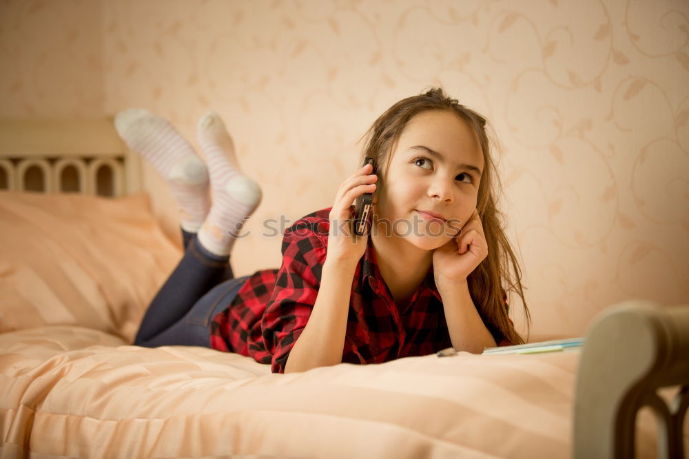 Similar – Image, Stock Photo Teenage girl listening to music and chatting with friends on smartphone sitting in hammock at home