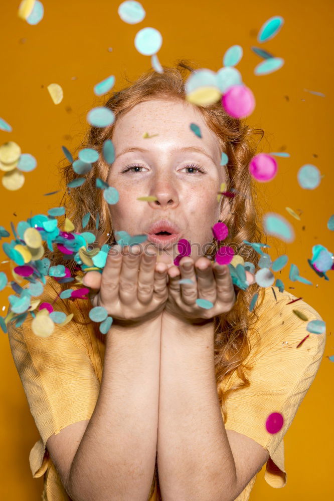 Similar – Black woman with afro hair celebrating with confetti.