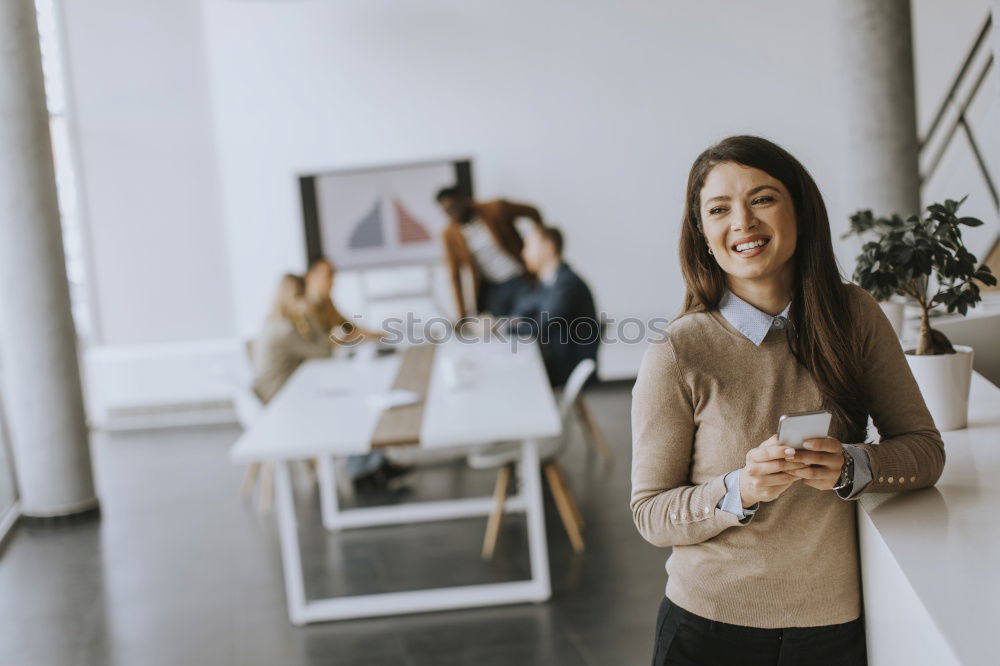 Similar – Young woman sitting at a kitchen table