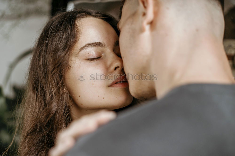 Similar – Couple with fluorescent paint kissing