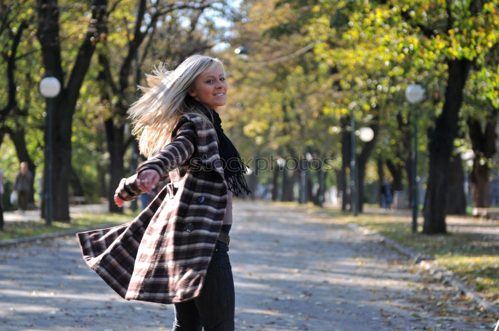 Similar – Woman enjoys sun on park bench